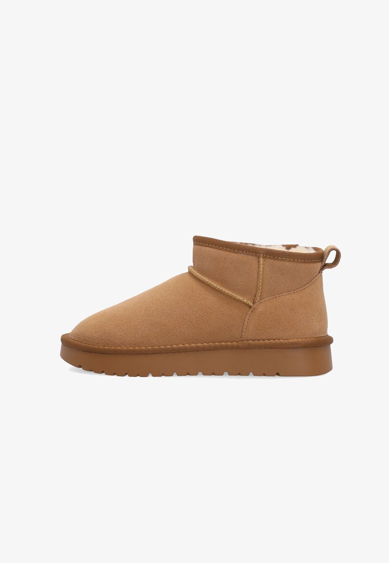 Brown suede ankle boot with flat rubber sole and fur lining visible at the top, showing side profile on a white background.