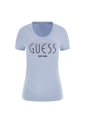 Light blue short-sleeve T-shirt featuring "GUESS" in metallic letters and "EST. 1981" underneath, made of soft cotton with a rounded neckline.