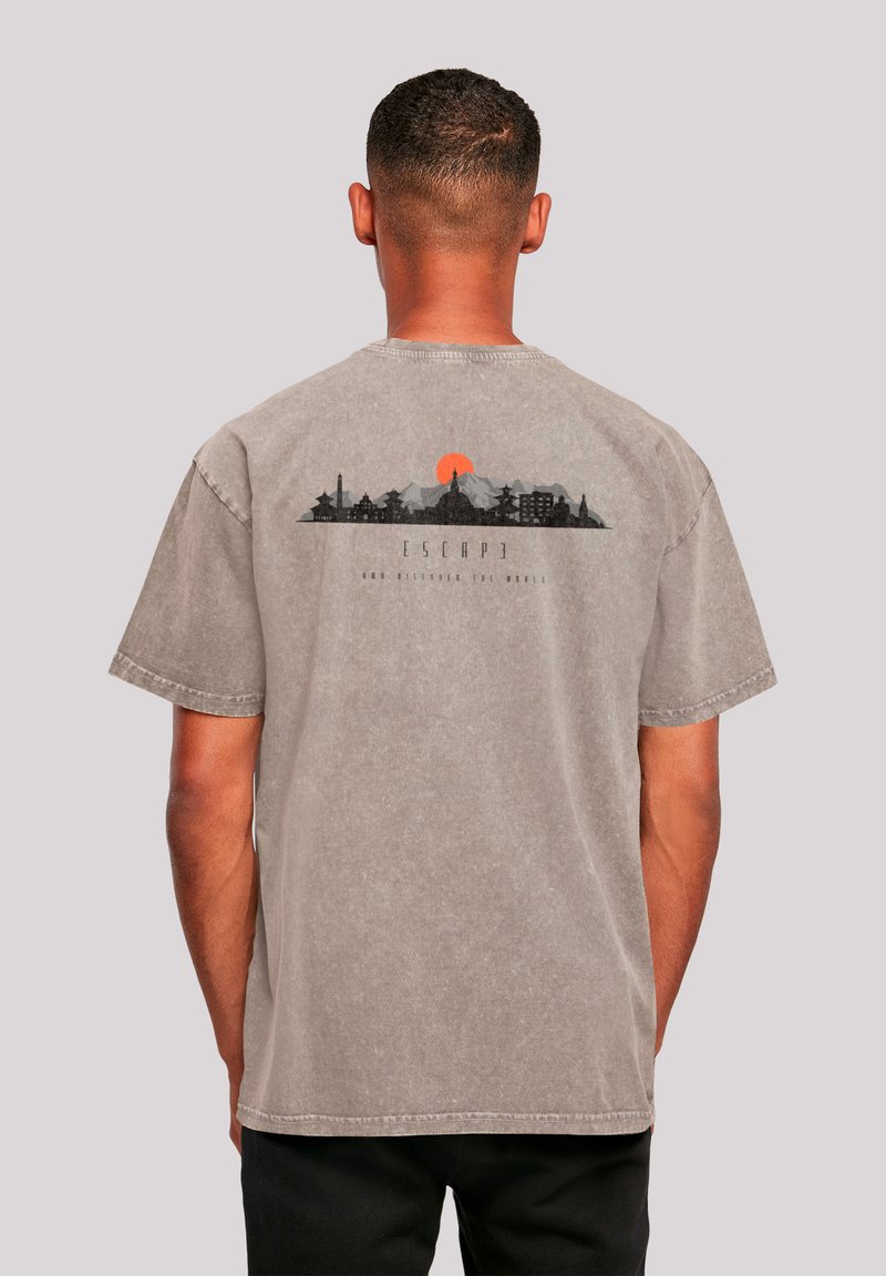 Gray cotton t-shirt with short sleeves. Back design features a city skyline silhouette and orange sun, with the word "ESCAPE."