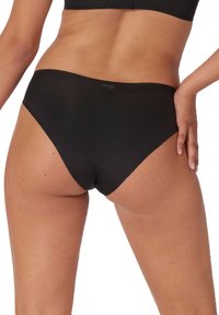 Zwarte bikini slip van katoenmix met een naadloos ontwerp en een zachte textuur, met een subtiele logo aan de tailleband.