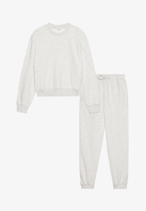 Light gray sweatshirt and matching sweatpants in a soft, knit fabric. The sweatshirt has a crew neck and ribbed cuffs; pants feature an elastic waistband.