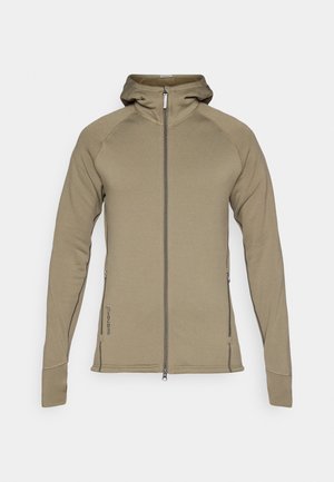 Sweat à capuche zippé en polaire kaki, avec un col montant, une fermeture à glissière à l'avant, des poches latérales et des coutures contrastées. Texture douce.