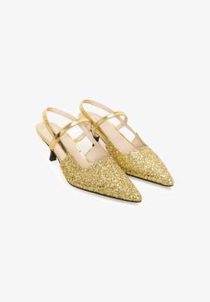 Gold glitter slingback heels with pointed toes, featuring two thin ankle straps and a low black heel. Smooth interior lining.