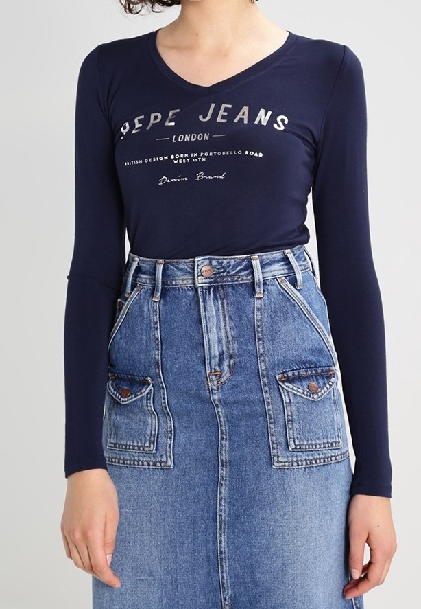 Navy long-sleeve top with "Pepe Jeans London" graphic, paired with a high-waisted denim skirt featuring pocket embellishments and a-button closure.