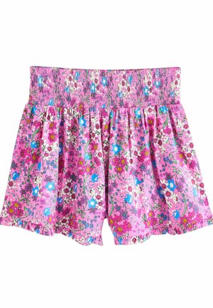 Roze bloemenkorte broek met een smocktailleband, gekenmerkt door een levendig patroon van kleine bloemen in blauw, wit en geel op een lichtgewicht stof.