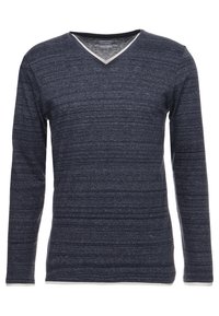 Mörkblå långärmad V-ringad skjorta med ett texturerat mönster och en kontrasterande ljus färgad halsringning. Mjuk och lätt vikt.