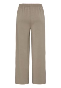 Pantalon beige à jambes larges avec taille élastique, fabriqué en tissu doux, idéal pour une tenue décontractée.