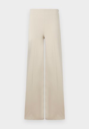 Pantaloni beige a gamba larga realizzati in tessuto morbido con una texture liscia. Presentano una vita alta elasticizzata per il massimo comfort e un design pulito e minimalista.