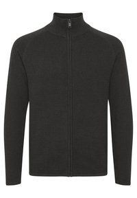 Giacca nera con zip realizzata in tessuto a coste. Presenta un colletto alto e maniche lunghe con un design pulito e minimalista.