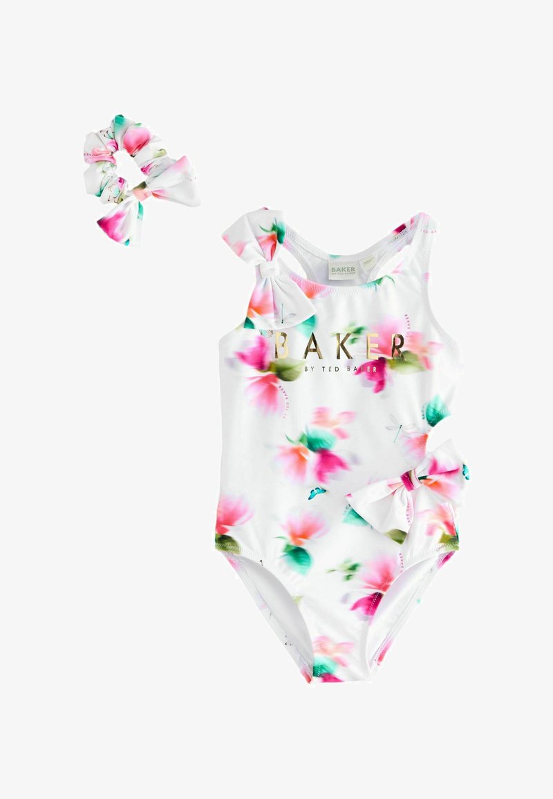 Bijeli kupaći kostim za malu djecu s ružičastim i zelenim cvjetovima, mašnicama na ramenu i boku, te odgovarajućom gumicom za kosu.
