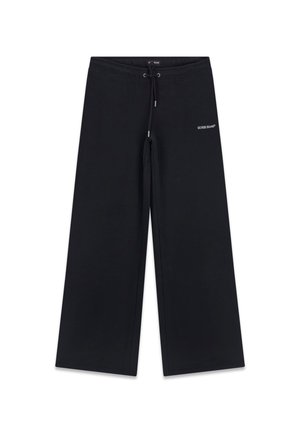 Czarne szerokie spodnie dresowe z elastycznym paskiem i sznurkiem oraz małym białym logo "GUESS JEANS" na górnej części lewego uda.