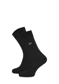 Czarne bawełniane skarpetki z prążkowanym mankietem, z małym białym logo po jednej stronie. Gładka faktura i standardowa długość do kostki.