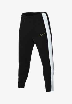Schwarze Sporthose mit weißen Seitenstreifen, elastischem Bund, Tasche und kleinem goldfarbenem Nike-Swoosh-Logo am linken Oberschenkel.