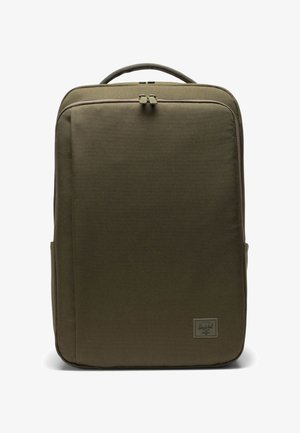 Olive green backpack made of durable fabric, featuring a smooth surface, dual zip closure, padded handle, and a small brand label on the front.