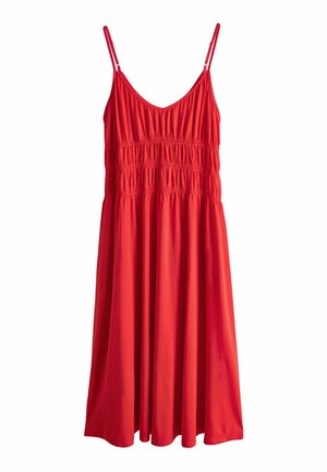 Red sleeveless dress with adjustable spaghetti straps and gathered elastic detailing across the bust and waist, flowing below the knee.