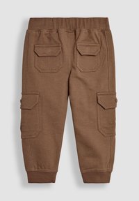 Bruna cargo-byxor i mjukt tyg med elastisk midja, två sidofickor och accentuerande sömmar, samt ribbade muddar.