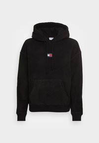 Felpa nera in pile con tasca a marsupio frontale, coulisse regolabile e una piccola patch del logo in rosso, bianco e blu sul petto.