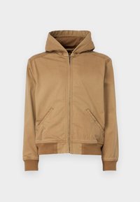 Jaqueta capuz bege com fecho éclair frontal completo, dois bolsos laterais, punhos canelados e uma textura suave. Apresenta costuras ao longo dos ombros.