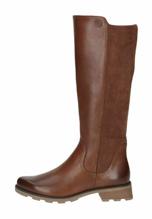 Bottine marron arrivant au genou avec une partie avant en cuir lisse et un tige en daim. Elle possède une semelle épaisse et un branding discret sur la partie supérieure.