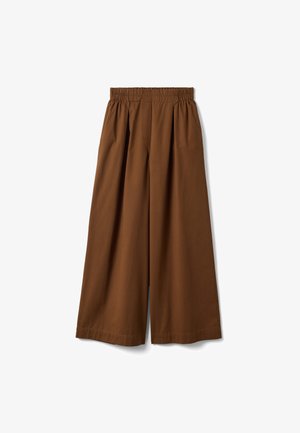 Brown wide-leg pants with elastic waistband and pleats, loose fit, ankle-length, displayed flat on white background.
