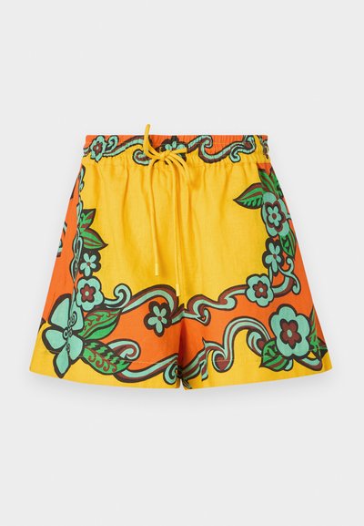 Yellow and orange shorts featuring floral patterns in green and brown. Elastic waistband with a drawstring, made of lightweight fabric.