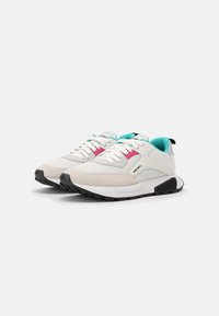 White athletic shoes featuring a mixture of mesh and suede materials. Accented with pink and turquoise details, and a black rubber sole.
