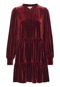 Viininpunainen samettimekko, jossa on löysä istuvuus, pitkät puff-hihat, V-mallinen kaula-aukko ja röyhelöhelma. Pehmeä rakenne ja tyylikäs muotoilu.