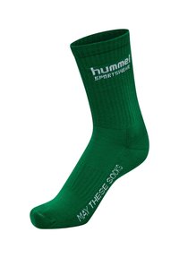 Gröna bomullsidrottssockor med ribbad textur. Har vit tryckt text: "hummel sportswear" på kanten och "MAY THESE GOONS" på sidan.