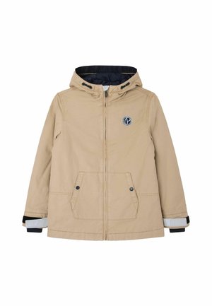 Veste à capuche beige avec fermeture éclair, deux poches avant, doublure bleu marine, et un logo circulaire sur la poitrine. Accents de poignets élastiques noirs.