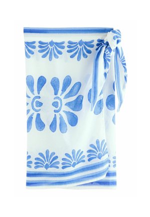 White fabric with a blue floral pattern, featuring stylized flowers and teardrop shapes, tied at the top with a blue ribbon.