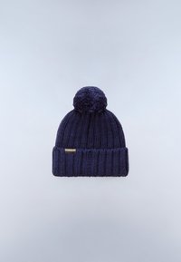 Dark blue knitted beanie with pom-pom on top and folded brim against a light gray background.