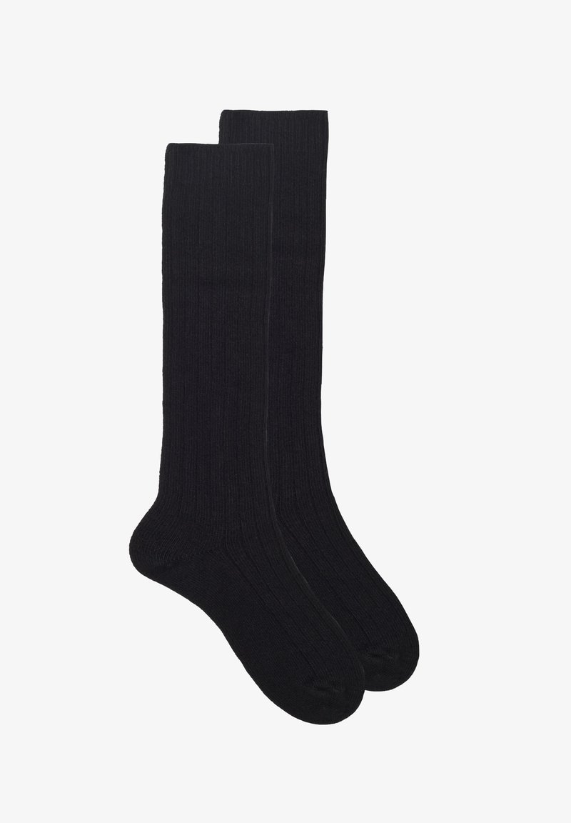 Svarta knälånga strumpor med ribbat mönster, med förstärkta tår och en slät yta. Enkel design utan mönster eller detaljer.