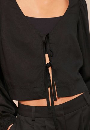 Next Pusero - black