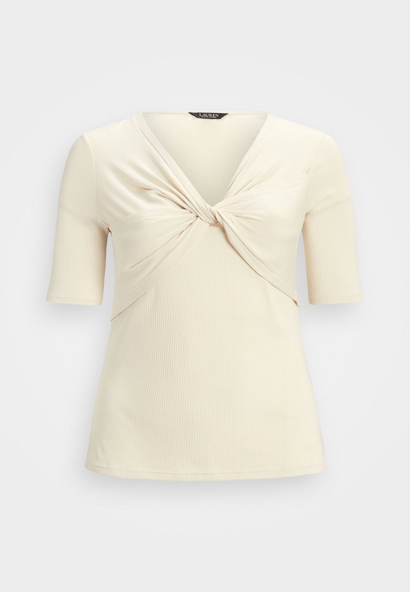 Beige, ribbed top with short sleeves and a twisted front detail creating a deep V-neck. Soft texture and fitted shape. Brand label visible.