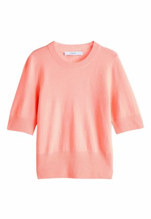 Koralowy sweter z krótkim rękawem wykonany z miękkiego materiału, z prążkowanym dekoltem i dołem. Prosty design o luźnym kroju.