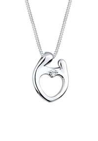 Sølvvedhæng i hjerteform med en lille diamantaccent, hængende fra en fin kæde. Glat, poleret overflade med et åbent design.