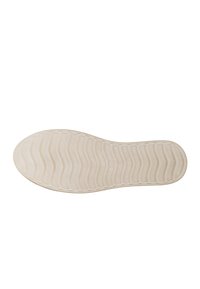 Suola di una scarpa in gomma beige chiaro, con un motivo testurizzato e ondulato. Mostra il numero di taglia 38 vicino all'area del tallone.