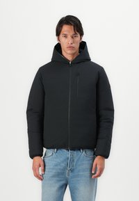 Black padded jacket with a hood, front zipper, and a chest pocket. Featured fabric is smooth and soft, with elastic cuffs and a minimal design.