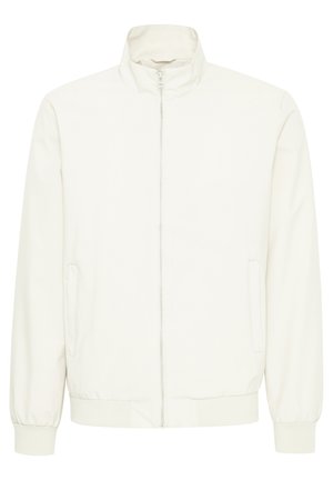 Balta laisvalaikio striukė su užtrauktuku, stovinčiu apykakle, elastingomis rankovėmis ir apačia. Turi šonines kišenes ir lygų, matinį paviršių.