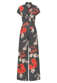 Floral jumpsuit features a black background with white stripes, bright red and pink flowers, short sleeves, and a wrap-style top.