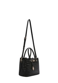 Black textured handbag with two short handles, a long adjustable shoulder strap, and gold-tone hardware details.