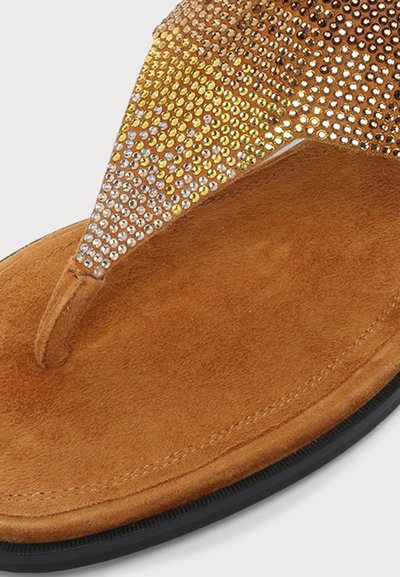 Brown suede sandal with black sole and gold and silver rhinestone-embellished thong strap for toe grip.