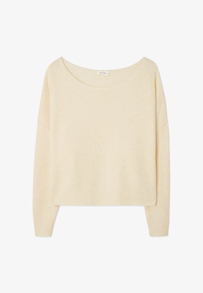 Pull à manches longues de couleur crème avec un large col rond et un ourlet et des poignets côtelés, présenté sur un fond blanc.