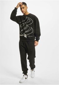 Roberto Cavalli Junior ROCAWEAR DUNCAN - Trainingsbroek - black