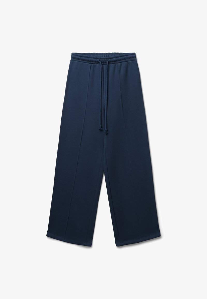Pantaloni tuta blu navy con vita regolabile, gamba larga e cuciture verticali. Realizzati in tessuto morbido e testurizzato.