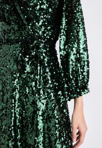 emerald green quince dress with flowers Vizcaya by Morilee Metallic Lace Quince Dress 89473 main image 0