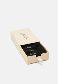 Black socks with embroidered logo, packaged in a cream-colored box with a "With Love" label, featuring a slide-out drawer design.