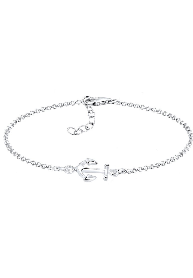 Bracciale con ancore in argento dotato di una delicata catena, con un charm a forma di ancora come principale dettaglio. Texture liscia e finitura lucida.