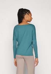 Yogasearcher DAKSHA - Hosszú ujjú felső - paon