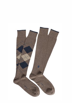 Calzini marroni fino al ginocchio con un motivo a diamante in blu navy e beige, dotati di polsini a costine di contrasto. Realizzati in un materiale morbido.